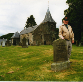 Lewis Jenkins by the grave of another member of the Newfoundland Timber Corps, Abbey St Bathans.jpg